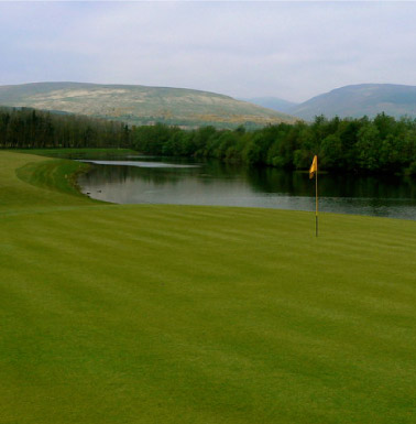 Carrick Golf Course, photograph of a green with hills in the background. CC-BY-SA/2.0 - © George Rankin - geograph.org.uk/photo/422974