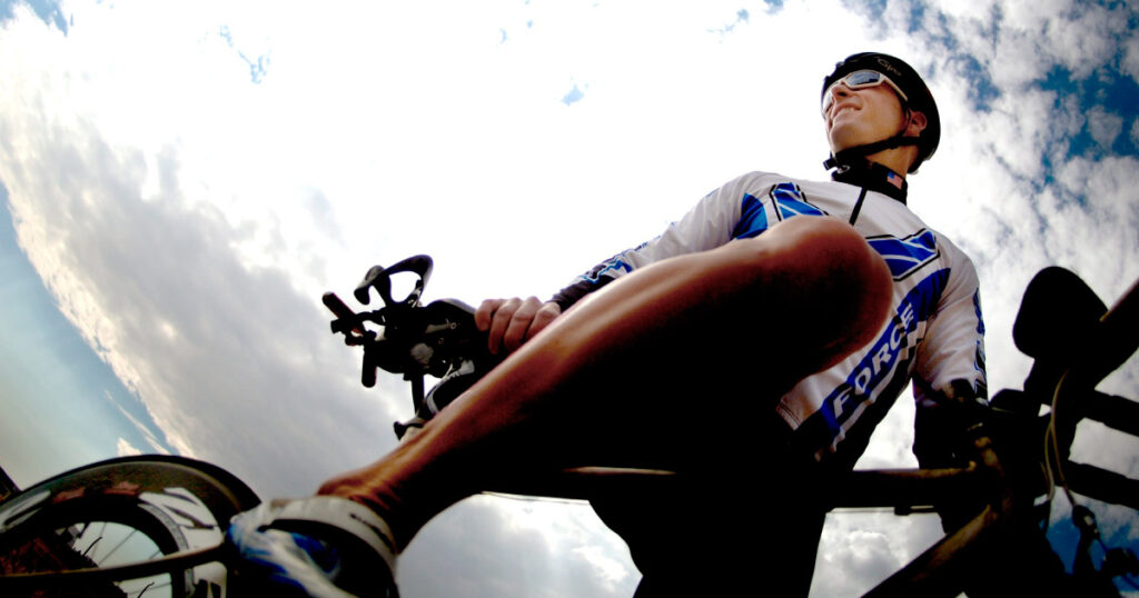 Photo of road cyclist, taken looking up against the sky. Image souce: https://pixabay.com/photos/cycling-cyclist-bicycle-rider-664753/