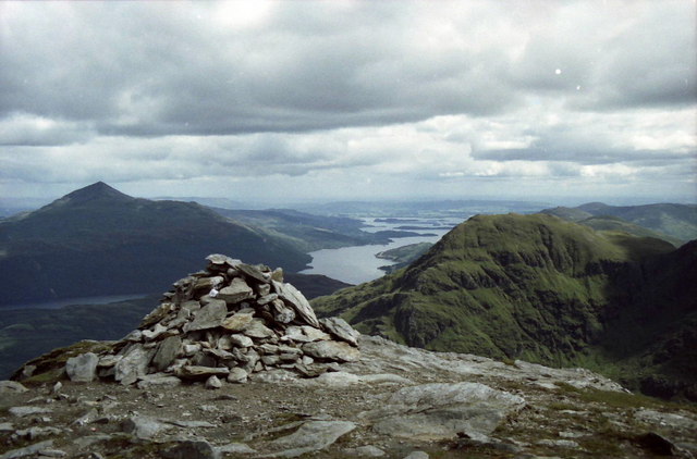 Summit cairn on Ben Vane. Ben Lomond, Loch Lomond and A'Chrois beyond. © Russel Wills, CC BY-SA 2.0 Image source: https://www.geograph.org.uk/photo/1628312