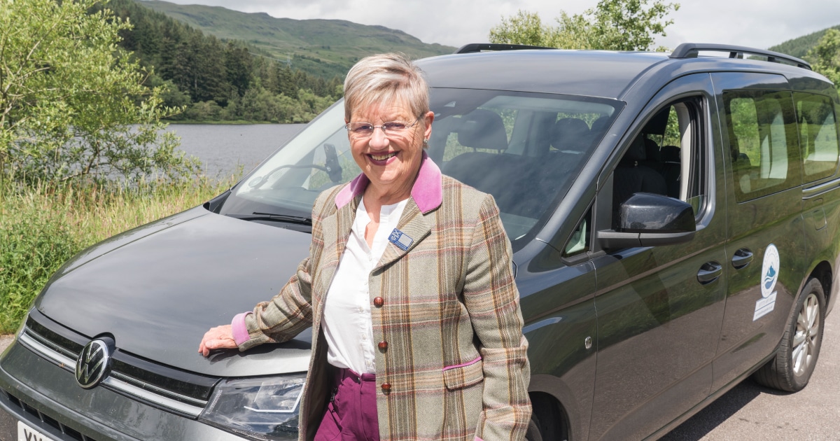 Kathy Cameron Scottish tour guide with one of her vehicles